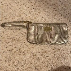 Gently used gold Fossil Clutch